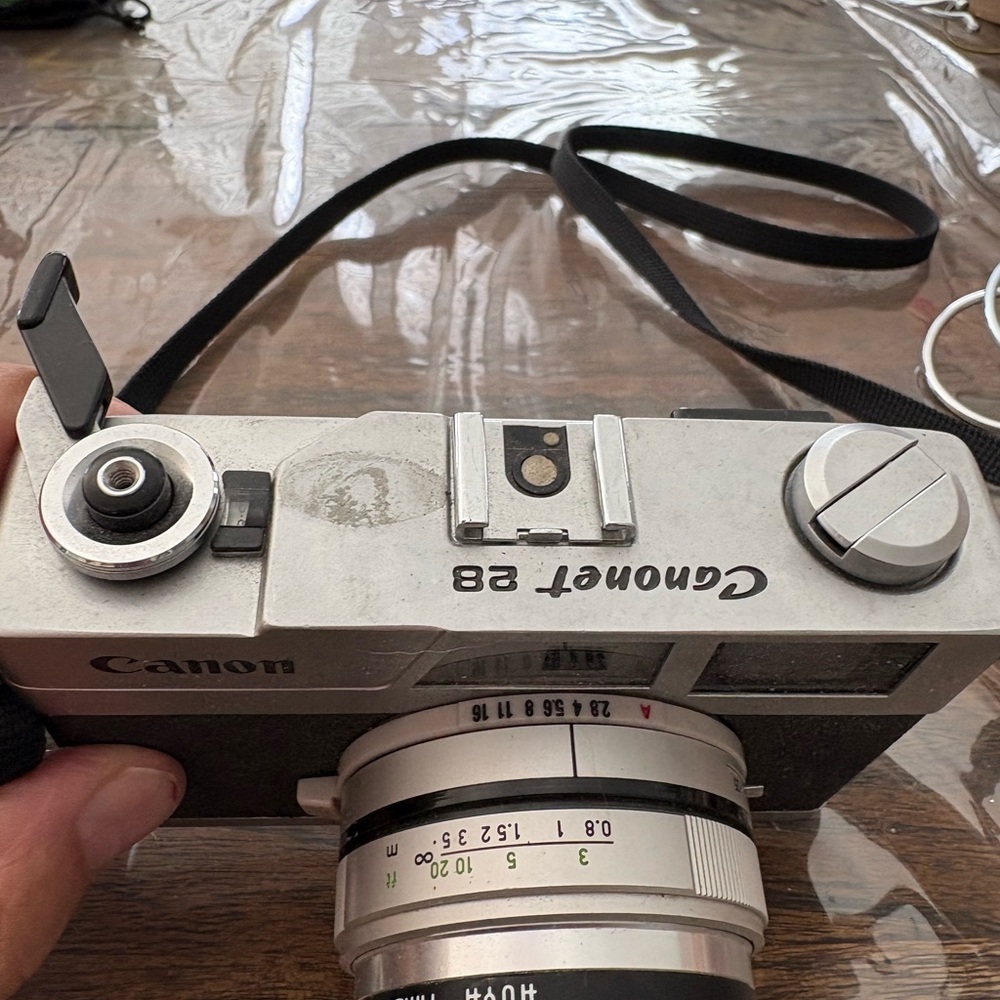 Canon Black and Silver Camera with Strap - Picture 2 of 4